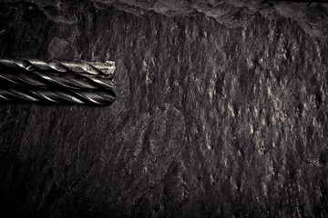 Close up of drill bits on stone surface