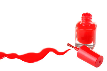 green nail Polish in the bottle near the hand and a little spilled on white isolated background.Brush strokes