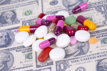 Pills and money. Health care concept