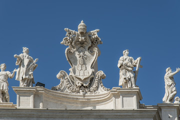 Sculptures from a white stone against the blue sky
