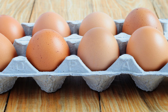 Side view of an eggs on a paper tray