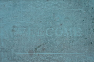 Pastel green old welcome mat