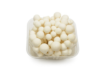 White shimeji mushrooms in box on white background