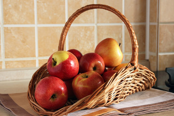 Basket with apples on the table..