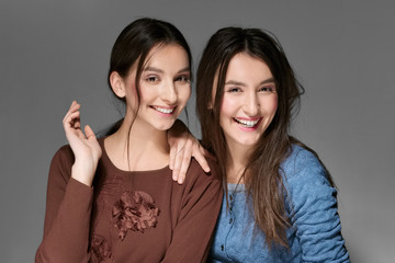 portrait of two girls laughing and smiling