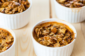 Tasty Dessert from Coconut Milk, Almonds and Honey on Light White Wooden Background, Horizontal View