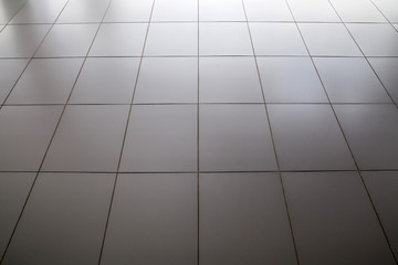 Reflective floor metal square texture.