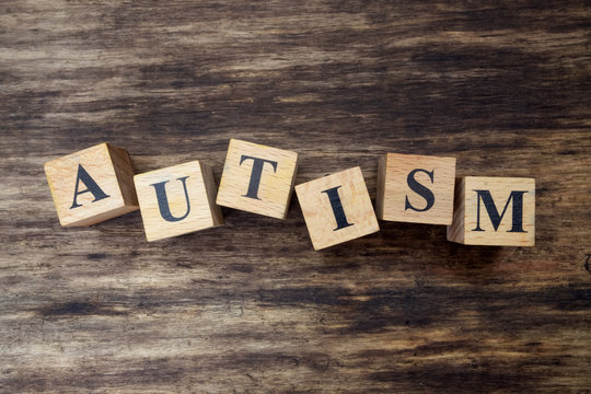 concept of autism word on wooden cubes