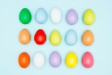 Colorful easter eggs on pastel background