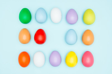 Colorful easter eggs on pastel background