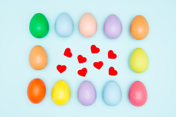 Colorful easter eggs on pastel background