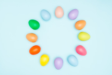 Colorful easter eggs on pastel background