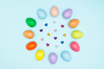 Colorful easter eggs on pastel background