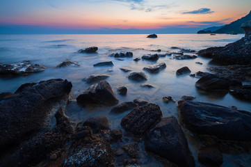 Fototapeta na wymiar Sunset at rocky coast