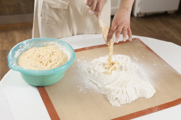 Making dough by hands at bakery