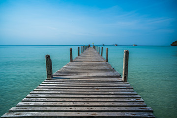 Tropical sea and wooden pier, holiday background