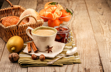 Cappuccino coffee in cup and fruits for breakfast