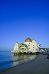 View of beautiful Malacca Straits Mosque during bright blue sky with copyspace area