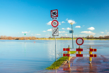 Flooded road in front of the Dutch river IJssel