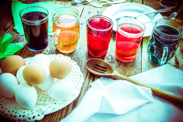 Colored eggs wooden table rural hut