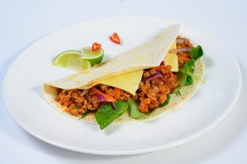 Tacos on a white plate