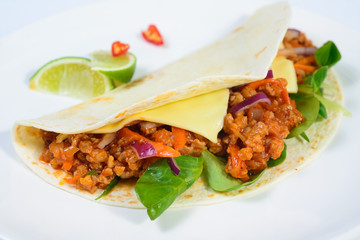 Tacos on a white plate
