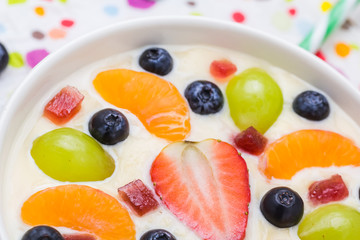 Colorful spring dessert vanilla pudding fruit
