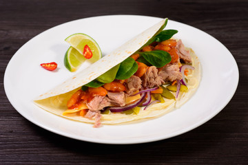 Tacos on a white plate