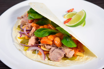 Tacos on a white plate