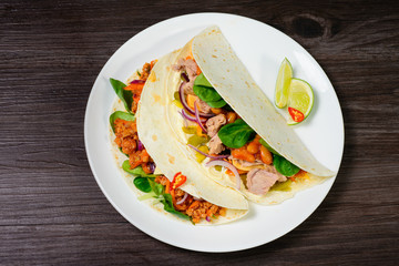 Tacos on a white plate