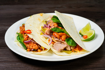 Tacos on a white plate