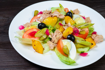 salad with meat,egg, tomatoes, olives and vegetables