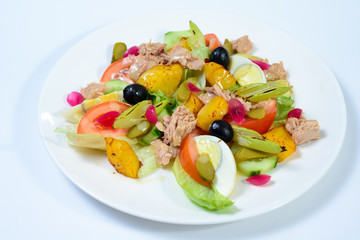 salad with meat,egg, tomatoes, olives and vegetables