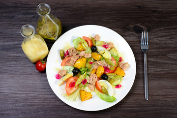 salad with meat,egg, tomatoes, olives and vegetables