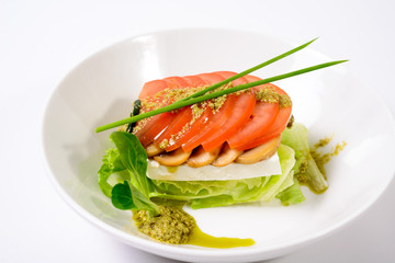 classic Caprese salad with tomatoes, cheese, herbs and sauce