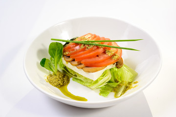 classic Caprese salad with tomatoes, cheese, herbs and sauce