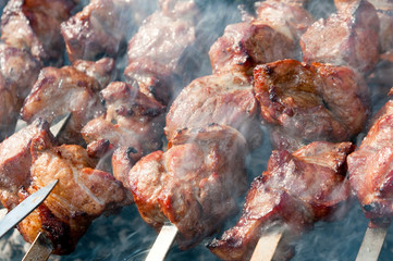 Brazier with the preparing shish kebab on skewers