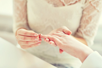 close up of lesbian couple hands with wedding ring