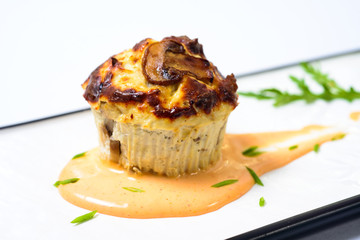 Souffle of chicken in cheese sauce