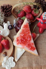 Fresh strawberries red and jam with bread.
