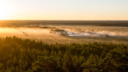 Foggy colorful morning above fields