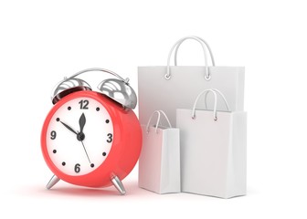 alarm clock and shopping bag (time to buy concept)