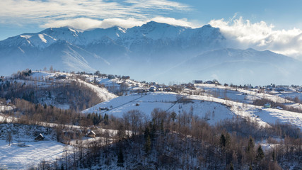 Fototapeta na wymiar Transcarpathians village in the mountains covered by snow. Ukraine