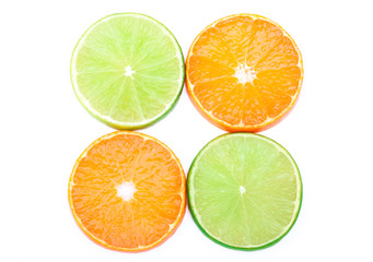 Tangerines and limes slices isolated on the white background with clipping path