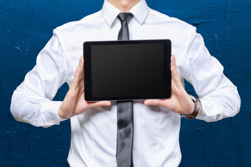 High resolution businessman holding digital tablet