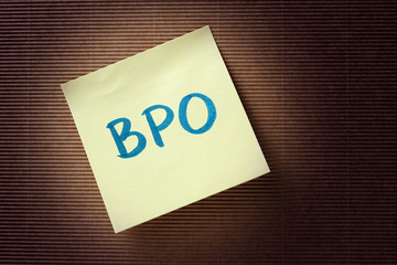 BPO (Business Process Outsourcing) acronym on yellow sticky note