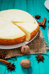 
pastries, desserts , curd pudding with milk,cottage cheese casserole , cinnamon and nuts on a wooden background