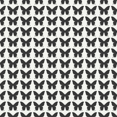 Monochrome abstract seamless pattern with butterfly. Wrapping paper. Scrapbook. Tiling. Vector illustration. Background. Graphic texture for your design, wallpaper. 