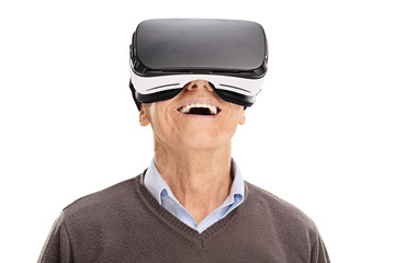 Cheerful senior using a VR headset