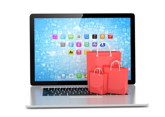 laptop and  shopping pags on white background